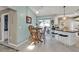 Cozy kitchen featuring a wooden dining table with backyard patio views through sliding glass doors at 321 Pessoa St, Punta Gorda, FL 33983