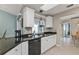 The kitchen features modern appliances, granite counters, and plenty of natural light at 321 Pessoa St, Punta Gorda, FL 33983