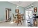 Cozy kitchen featuring a wooden dining table with backyard patio views through sliding glass doors at 321 Pessoa St, Punta Gorda, FL 33983