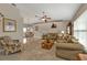 Spacious living room with vaulted ceilings, comfortable seating, and views into the dining area at 321 Pessoa St, Punta Gorda, FL 33983