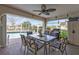 Covered patio with grill, dining table, outdoor seating, and views of the pool and backyard at 321 Pessoa St, Punta Gorda, FL 33983