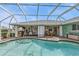 Inviting screened-in pool with spacious deck area and multiple seating areas for entertaining at 321 Pessoa St, Punta Gorda, FL 33983