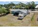 Aerial view of the home highlighting the backyard, screened porch, and convenient storage shed at 3566 Shamrock Dr, Venice, FL 34293