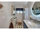 Charming bathroom featuring unique star-patterned tile flooring and coastal-themed decorations at 3906 Crooked Island Dr, Punta Gorda, FL 33950