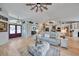 Bright and open living room featuring a decorative ceiling fan and view of the entry at 3906 Crooked Island Dr, Punta Gorda, FL 33950