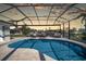 Tranquil pool with a screened enclosure, and waterfront views at 3906 Crooked Island Dr, Punta Gorda, FL 33950