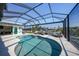 Sparkling pool surrounded by a screened enclosure and outdoor seating area at 3906 Crooked Island Dr, Punta Gorda, FL 33950