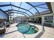 Private pool area featuring a screened enclosure and relaxing outdoor furniture at 3906 Crooked Island Dr, Punta Gorda, FL 33950