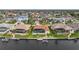 Aerial view of neighborhood with waterfront homes and boat docks at 3961 San Pietro Ct, Punta Gorda, FL 33950