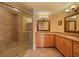 Bathroom featuring tiled shower with seat, granite counters and double-sink vanity at 3961 San Pietro Ct, Punta Gorda, FL 33950