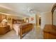 Cozy bedroom boasts tile floors, a ceiling fan, and decorative crown molding at 3961 San Pietro Ct, Punta Gorda, FL 33950