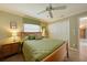 Bedroom featuring tile floors, ceiling fan and a closet with bi-fold doors at 3961 San Pietro Ct, Punta Gorda, FL 33950