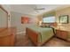Bedroom with tile floors, ceiling fan and a wooden dresser and night stands at 3961 San Pietro Ct, Punta Gorda, FL 33950