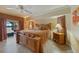 Cozy bedroom boasts tile floors, a ceiling fan, and views from a screened lanai at 3961 San Pietro Ct, Punta Gorda, FL 33950