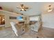 Bright living room with tile flooring, vaulted ceilings, and plantation shutters, creating a cozy and inviting atmosphere at 3961 San Pietro Ct, Punta Gorda, FL 33950