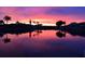 Beautiful sunset view over the water, showcasing vibrant pink and purple hues in the sky at 3961 San Pietro Ct, Punta Gorda, FL 33950