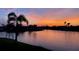 Picturesque waterfront view at sunset with vibrant sky reflecting on the tranquil water at 3961 San Pietro Ct, Punta Gorda, FL 33950