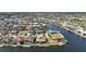 A scenic aerial view of waterfront homes with private docks in a community, highlighting access to the water at 413 Valletta Ct, Punta Gorda, FL 33950