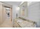 Bathroom featuring a granite vanity and ship lap wall at 413 Valletta Ct, Punta Gorda, FL 33950