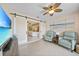 Sitting area with wide sliding doors and comfortable seating, adjacent to a bedroom at 413 Valletta Ct, Punta Gorda, FL 33950