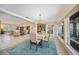 Open concept dining room with large windows overlooking the water at 413 Valletta Ct, Punta Gorda, FL 33950