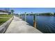 A private boat dock extending into the water, offering direct access and waterfront living, and a place for boating at 413 Valletta Ct, Punta Gorda, FL 33950