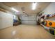 The garage has an epoxy floor, storage cabinets, kayaks and overhead storage at 413 Valletta Ct, Punta Gorda, FL 33950