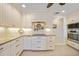 Stylish kitchen equipped with custom cabinets, granite counters, and stainless appliances at 413 Valletta Ct, Punta Gorda, FL 33950