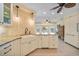 Well-appointed kitchen with custom cabinets, granite countertops, and a farmhouse sink at 413 Valletta Ct, Punta Gorda, FL 33950