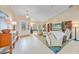 Bright living room featuring tile floors, vaulted ceiling, and natural light at 413 Valletta Ct, Punta Gorda, FL 33950