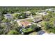 Aerial view of a single Gathering house with fenced backyard in a quiet neighborhood at 4442 Kenvil Dr, North Port, FL 34288