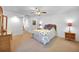 Bright bedroom with neutral walls, a ceiling fan, and carpet flooring creates a relaxing space at 468 Paramaribo St, Punta Gorda, FL 33983