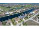 Aerial view showcasing waterfront location of home and community golf course at 5032 La Costa Island Ct, Punta Gorda, FL 33950