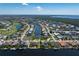 Expansive aerial view of the property showcasing its canal-front location and neighborhood amenities at 5032 La Costa Island Ct, Punta Gorda, FL 33950