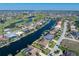 Waterfront home boasts canal access, lush landscaping, and an inviting outdoor space for relaxation at 5032 La Costa Island Ct, Punta Gorda, FL 33950