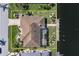 Waterfront estate features private dockage, beautiful landscaping, and tranquil coastal living at 5032 La Costa Island Ct, Punta Gorda, FL 33950