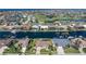 Aerial view of the property showcasing canal front location and proximity to community golf course at 5032 La Costa Island Ct, Punta Gorda, FL 33950