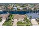 Stunning aerial view highlighting waterfront property with private dock, outlined in yellow at 5032 La Costa Island Ct, Punta Gorda, FL 33950