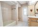 Bathroom boasts a tile shower and a vanity with elegant vanity mirror at 5032 La Costa Island Ct, Punta Gorda, FL 33950