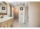 Bathroom boasts a tile shower and a vanity with elegant vanity mirror at 5032 La Costa Island Ct, Punta Gorda, FL 33950