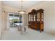 Dining room with large china cabinet and view of the outdoor lanai at 5032 La Costa Island Ct, Punta Gorda, FL 33950