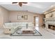Living room featuring a fireplace, neutral walls, tile flooring, and comfortable seating at 5032 La Costa Island Ct, Punta Gorda, FL 33950