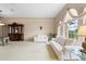 Bright living room with white sofas, large window, and decorative accents at 5032 La Costa Island Ct, Punta Gorda, FL 33950