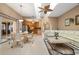Open floor plan showcasing a kitchen, dining area, and living room with large windows at 5032 La Costa Island Ct, Punta Gorda, FL 33950