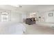 Large bedroom features walk-in closets, dressing table, ceiling fan, and sitting area at 5032 La Costa Island Ct, Punta Gorda, FL 33950
