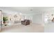 Spacious main bedroom with sitting area, dressing table, large closets, ceiling fan, and skylight at 5032 La Costa Island Ct, Punta Gorda, FL 33950