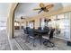 Covered lanai features ceiling fans, a table with chairs, and access to the pool and outdoor spaces at 5032 La Costa Island Ct, Punta Gorda, FL 33950