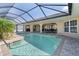 Refreshing pool area featuring a covered lanai, perfect for outdoor relaxation and entertainment at 5032 La Costa Island Ct, Punta Gorda, FL 33950