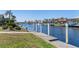 Scenic waterfront view with lush landscaping, boat docks, and houses along the canal at 5032 La Costa Island Ct, Punta Gorda, FL 33950