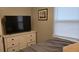 Bedroom with large dresser and a window at 5100 Bullard St, North Port, FL 34287